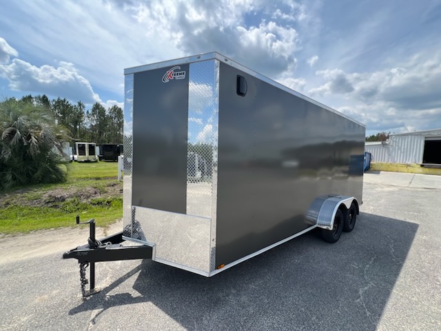 White enclosed trailer with rear ramp door, perfect for motorcycle transport and secure hauling